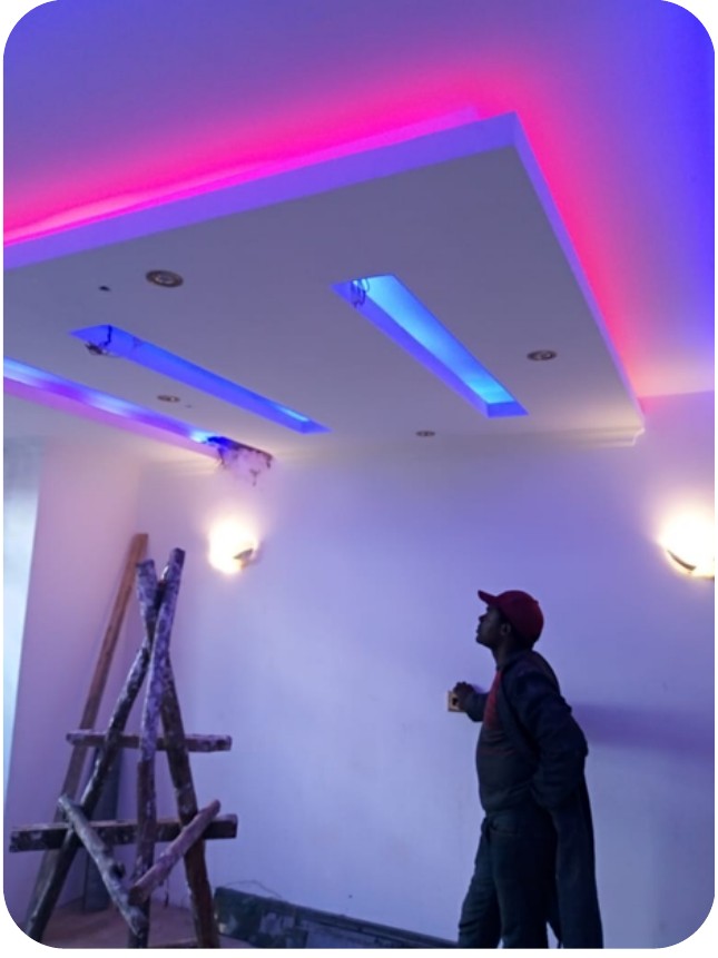 Technician completing an interior lighting installation